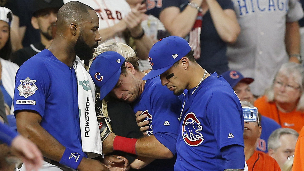 HOUSTON, TEXAS - MAY 29: Albert Almora Jr. #5 of the Chicago Cubs is comforted by Jason Heyward #22 and Javier Baez #9 after a young child is rushed from the stands after being hit by a hard foul ball off the bat of Albert Almora Jr. #5 of the Chicago Cubs in the fourth inning against the Houston Astros at Minute Maid Park on May 29, 2019 in Houston, Texas.