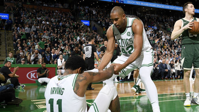BOSTON, MA - MAY 6: Al Horford #42 helps Kyrie Irving #11 of the Boston Celtics from the floor during Game Four of the Eastern Conference Semifinals of the 2019 NBA Playoffs on May 6, 2019 at the TD Garden in Boston, Massachusetts. NOTE TO USER: User expressly acknowledges and agrees that, by downloading and/or using this photograph, user is consenting to the terms and conditions of the Getty Images License Agreement. Mandatory Copyright Notice: Copyright 2019 NBAE