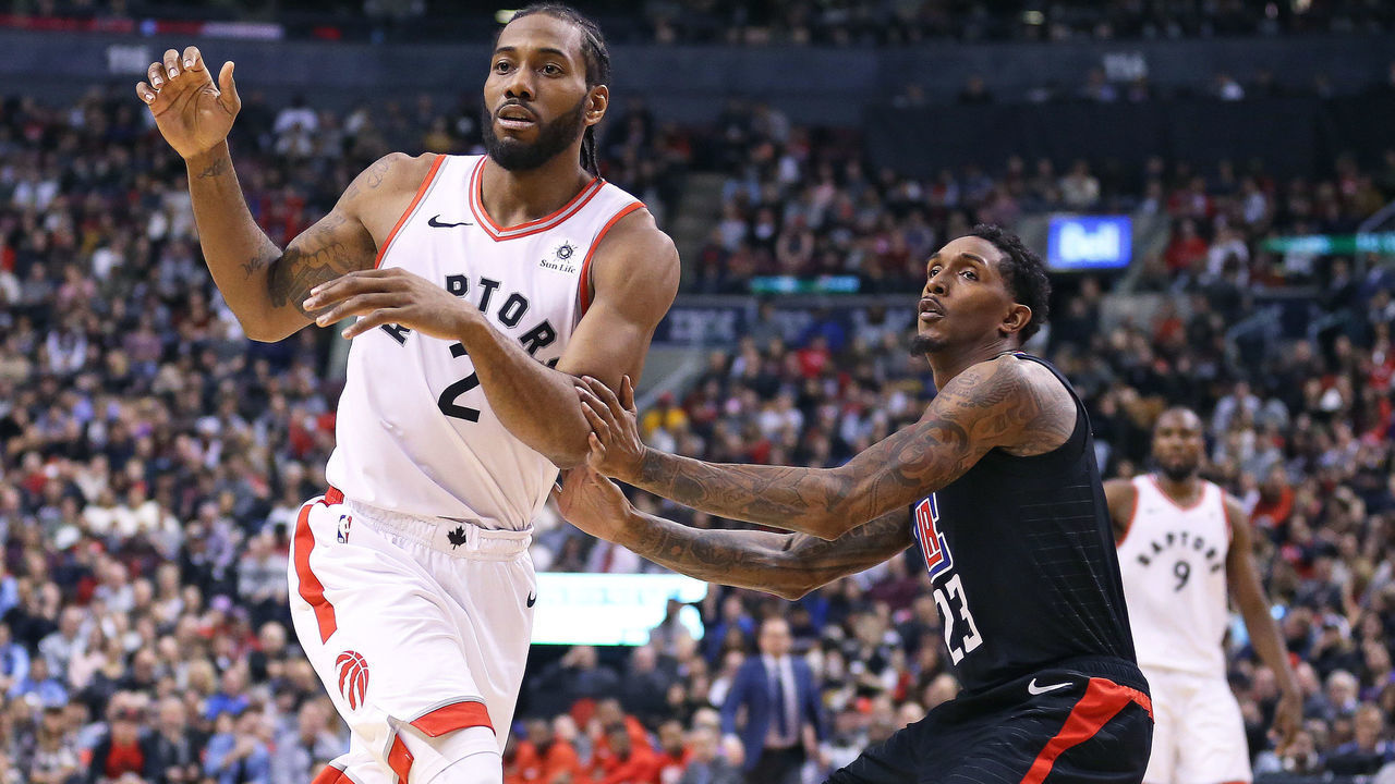 TORONTO, ON - FEBRUARY 3: Kawhi Leonard #2 of the Toronto Raptors looks for a pass in front of Lou Williams #23 of the Los Angeles Clippers in an NBA game at Scotiabank Arena on February 3, 2019 in Toronto, Ontario, Canada. The Raptors defeated the Clippers 121-103. NOTE TO USER: user expressly acknowledges and agrees by downloading and/or using this Photograph, user is consenting to the terms and conditions of the Getty Images Licence Agreement.