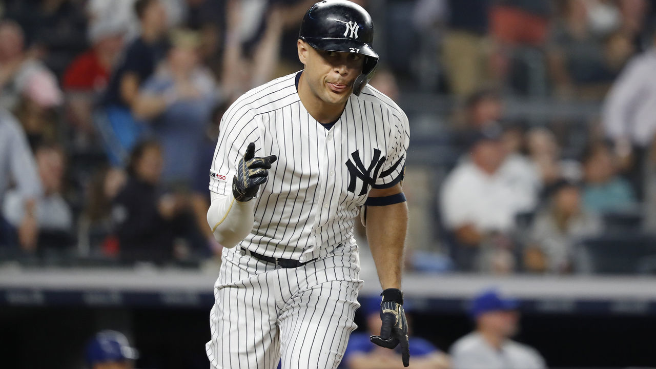 NEW YORK, NEW YORK - JUNE 24: Giancarlo Stanton #27 of the New York Yankees reacts to the dugout after hitting a three run home run against the Toronto Blue Jays in the sixth inning at Yankee Stadium on June 24, 2019 in New York City.