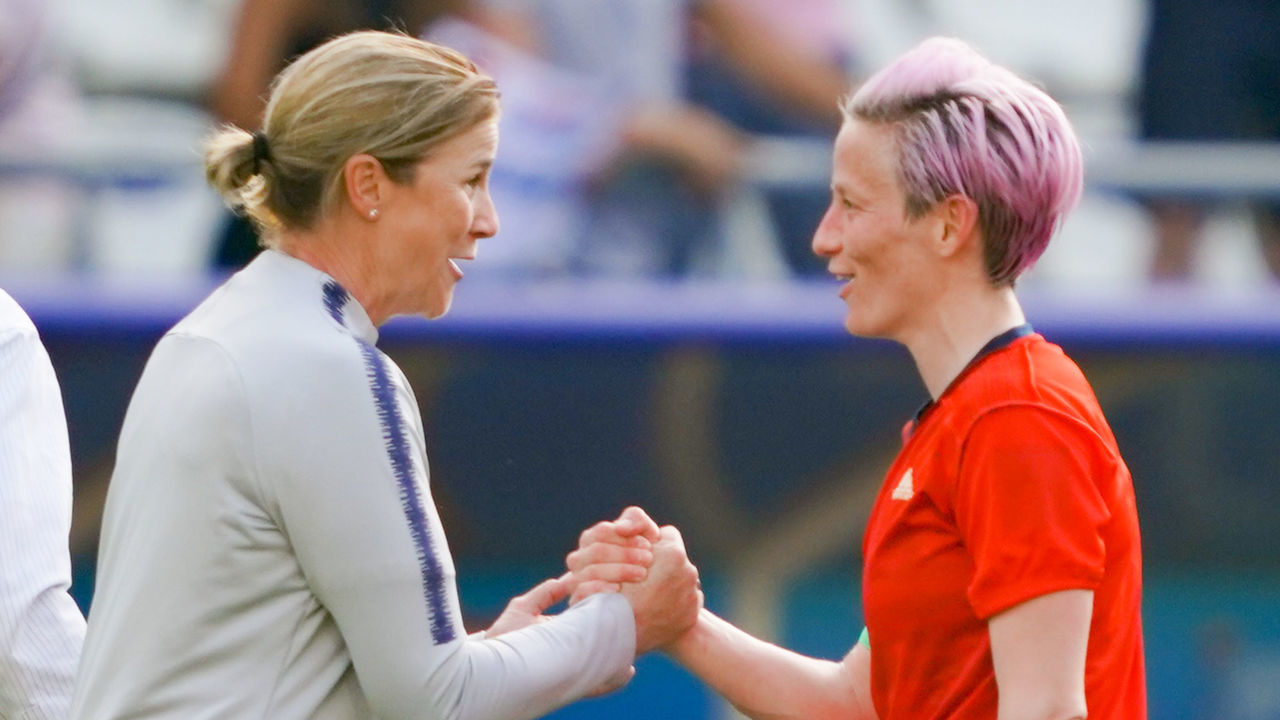 REIMS, FRANCE - JUNE 24: USA women's head coach Jill Ellis celebrates with Megan Rapinoe #15 after a 2019 FIFA Women's World Cup France Round of 16 match between Spain and the United States at Stade Auguste-Delaune on June 24, 2019 in Reims, France. .