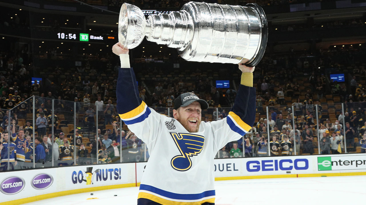 BOSTON, MASSACHUSETTS - JUNE 12: Carl Gunnarsson #4 of the St. Louis Blues hoists the Stanley Cup after the 2019 NHL Stanley Cup Final at TD Garden on June 12, 2019 in Boston, Massachusetts. The St. Louis Blues defeated the Boston Bruins 4-1 in Game 7 to win the Stanley Cup Final 4-3.