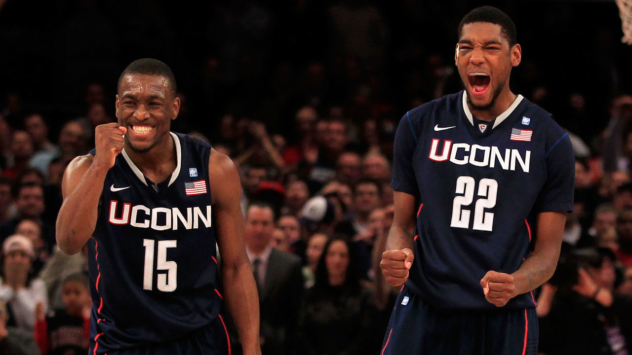 NEW YORK, NY - MARCH 12: Kemba Walker #15 and Roscoe Smith #22 of the Connecticut Huskies celebrate late in the game against the Louisville Cardinals during the championship of the 2011 Big East Men's Basketball Tournament presented by American Eagle Outfitters at Madison Square Garden on March 12, 2011 in New York City.