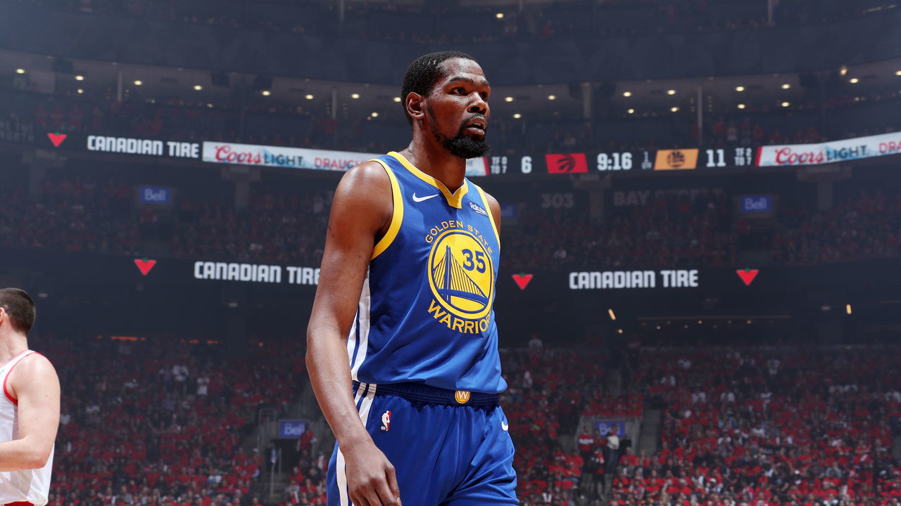 TORONTO, CANADA - JUNE 10: Kevin Durant #35 of the Golden State Warriors looks on against the Toronto Raptors during Game Five of the NBA Finals on June 10, 2019 at Scotiabank Arena in Toronto, Ontario, Canada. NOTE TO USER: User expressly acknowledges and agrees that, by downloading and/or using this photograph, user is consenting to the terms and conditions of the Getty Images License Agreement. Mandatory Copyright Notice: Copyright 2019 NBAE
