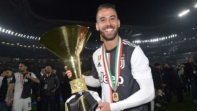 TURIN, ITALY - MAY 19: Leonardo Spinazzola of Juventus celebrates with the trophy after winning the Serie A Championship 2018-2019 (8th title in a row) at the end of the Serie A match between Juventus and Atalanta BC on May 19, 2019 in Turin, Italy.