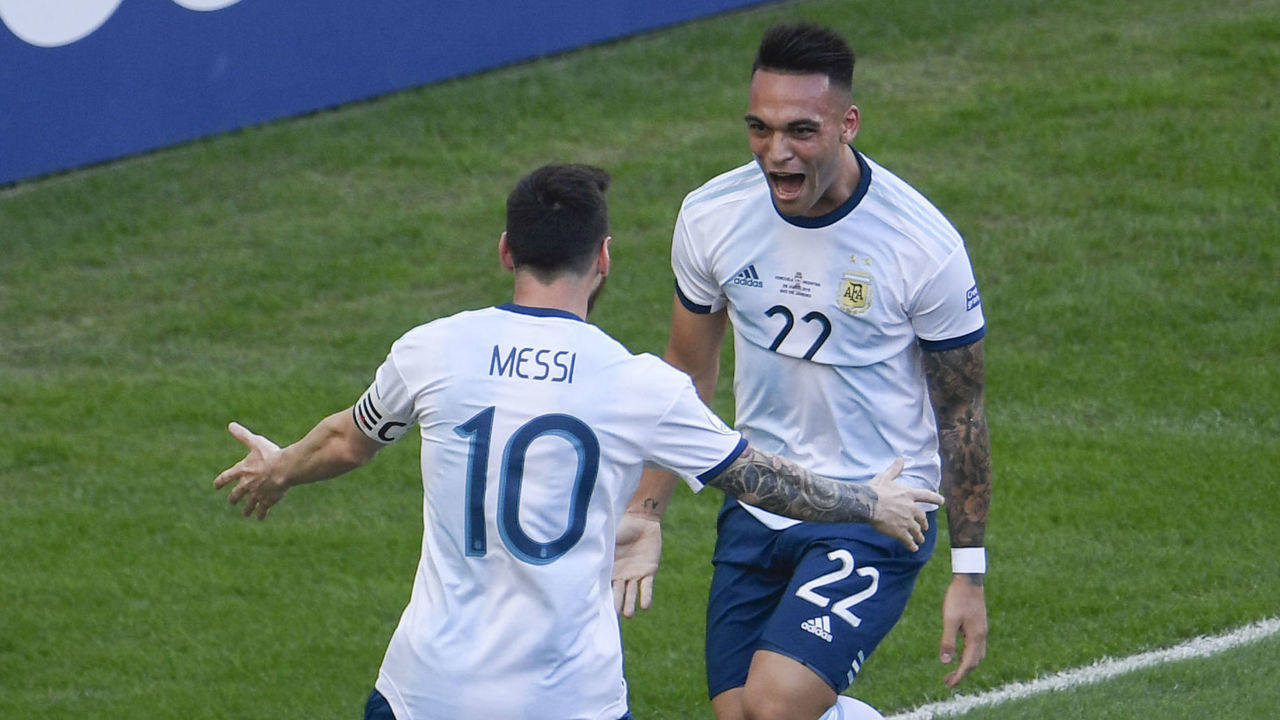 Argentina's Lautaro Martinez (R) celebrates with teammate Lionel Messi after scoring against Venezuela during their Copa America football tournament quarter-final match at Maracana Stadium in Rio de Janeiro, Brazil, on June 28, 2019.