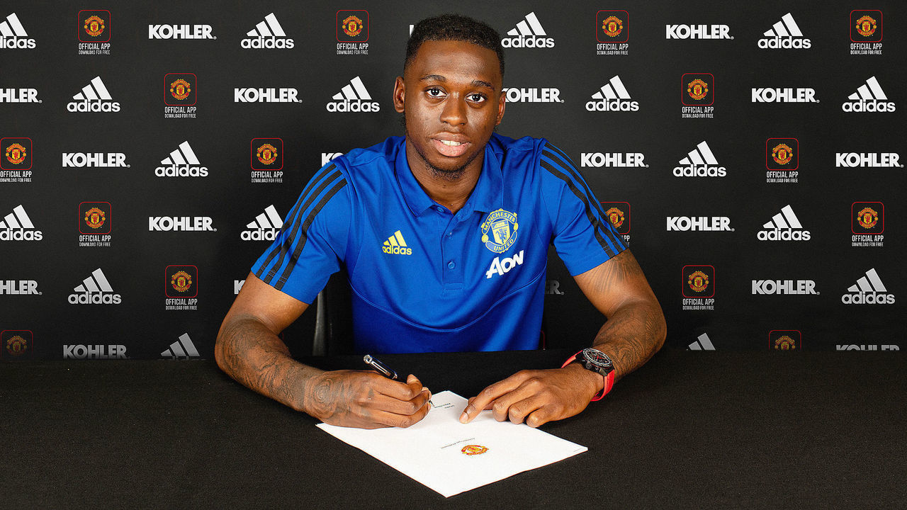 MANCHESTER, ENGLAND - JUNE 29: Aaron Wan-Bissaka of Manchester United poses after signing for the club at Aon Training Complex on June 29, 2019 in Manchester, England.