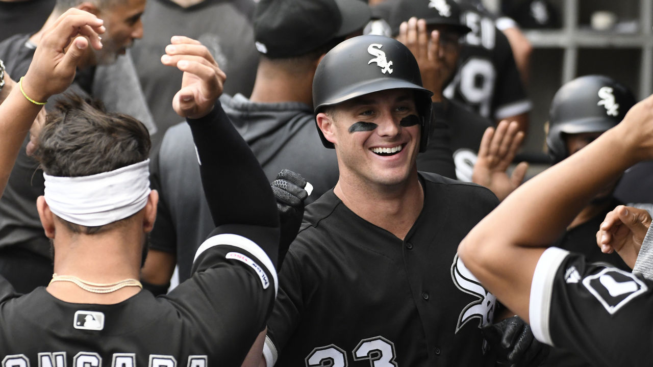 CHICAGO, ILLINOIS - JUNE 28: James McCann #33 of the Chicago White Sox is greeted after hitting a two tun home run against the Minnesota Twins during the first inning at Guaranteed Rate Field on June 28, 2019 in Chicago, Illinois.