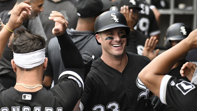 CHICAGO, ILLINOIS - JUNE 28: James McCann #33 of the Chicago White Sox is greeted after hitting a two tun home run against the Minnesota Twins during the first inning at Guaranteed Rate Field on June 28, 2019 in Chicago, Illinois.