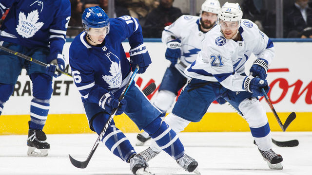 TORONTO, ON - APRIL 04: Mitch Marner #16 of the Toronto Maple Leafs skates against Brayden Point #21 of the Tampa Bay Lightning during the first period at the Scotiabank Arena on April 4, 2019 in Toronto, Ontario, Canada.