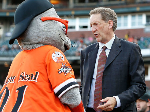 SAN FRANCISCO, CA - AUGUST 02: San Francisco Giants CEO Larry Baer talks to team mascot Lou Seal before an interleague game against the Oakland Athletics at AT&T Park on August 2, 2017 in San Francisco, California.