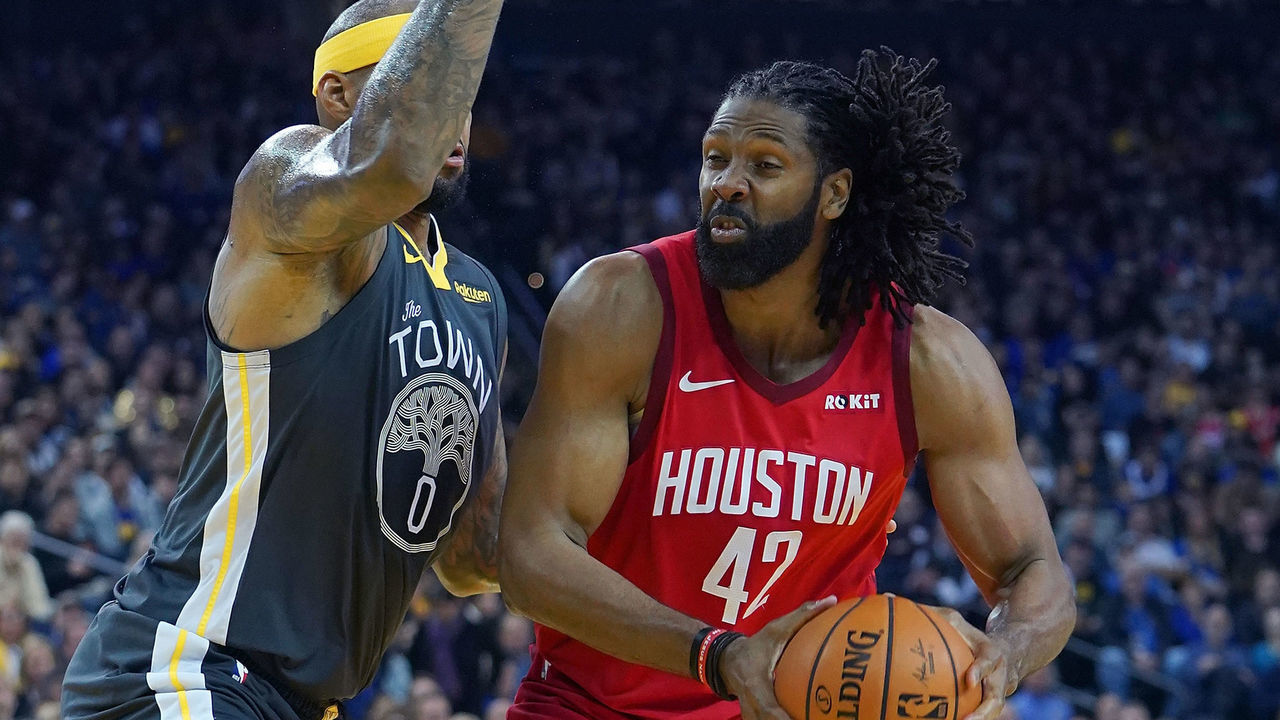 OAKLAND, CA - FEBRUARY 23: Nene Hilario #42 of the Houston Rockets looks to shoot over DeMarcus Cousins #0 of the Golden State Warriors during an NBA basketball game at ORACLE Arena on February 23, 2019 in Oakland, California.
