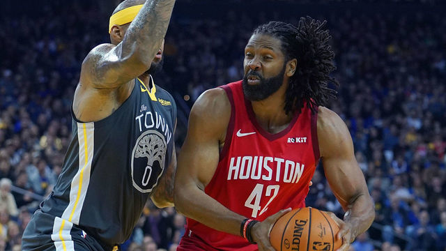 OAKLAND, CA - FEBRUARY 23: Nene Hilario #42 of the Houston Rockets looks to shoot over DeMarcus Cousins #0 of the Golden State Warriors during an NBA basketball game at ORACLE Arena on February 23, 2019 in Oakland, California.