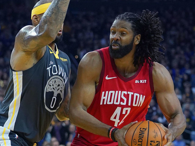OAKLAND, CA - FEBRUARY 23: Nene Hilario #42 of the Houston Rockets looks to shoot over DeMarcus Cousins #0 of the Golden State Warriors during an NBA basketball game at ORACLE Arena on February 23, 2019 in Oakland, California.