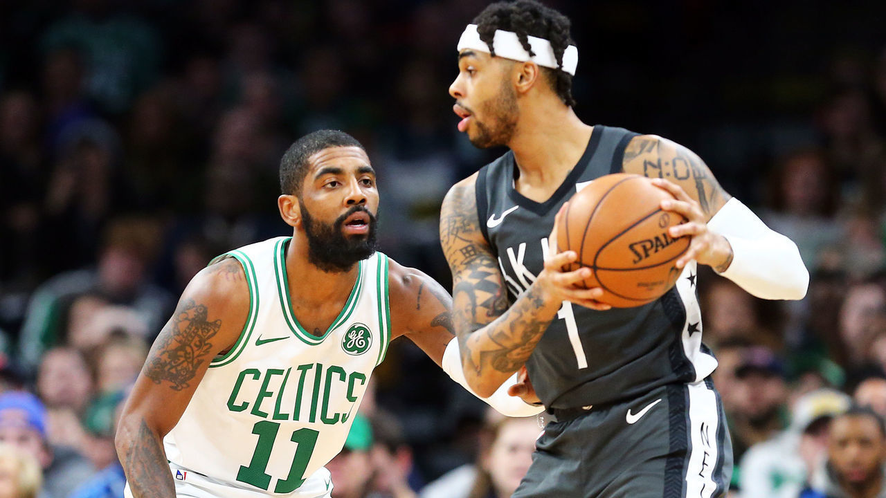 BOSTON, MA - JANUARY 07: D'Angelo Russell #1 of the Brooklyn Nets looks to pass the ball while guarded by Kyrie Irving #11 of the Boston Celtics during the first quarter of a game at TD Garden on January 7, 2019 in Boston, Massachusetts.