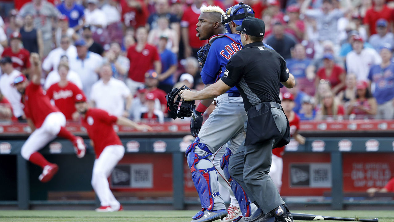 CINCINNATI, OH - JUNE 29: Yasiel Puig #66 of the Cincinnati Reds is restrained after being hit by a pitch from Pedro Strop #46 of the Chicago Cubs in the eighth inning at Great American Ball Park on June 29, 2019 in Cincinnati, Ohio. The Cubs won 6-0.