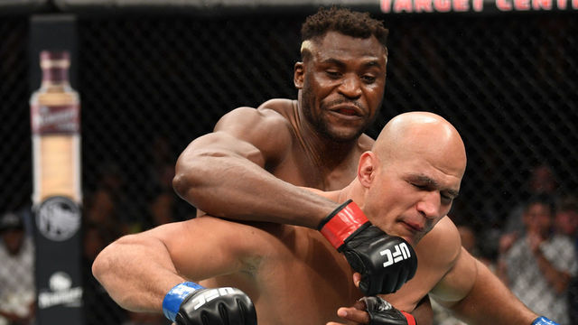 MINNEAPOLIS, MN - JUNE 29: (L-R) Francis Ngannou of Cameroon punches Junior Dos Santos of Brazil in their heavyweight bout during the UFC Fight Night event at the Target Center on June 29, 2019 in Minneapolis, Minnesota.