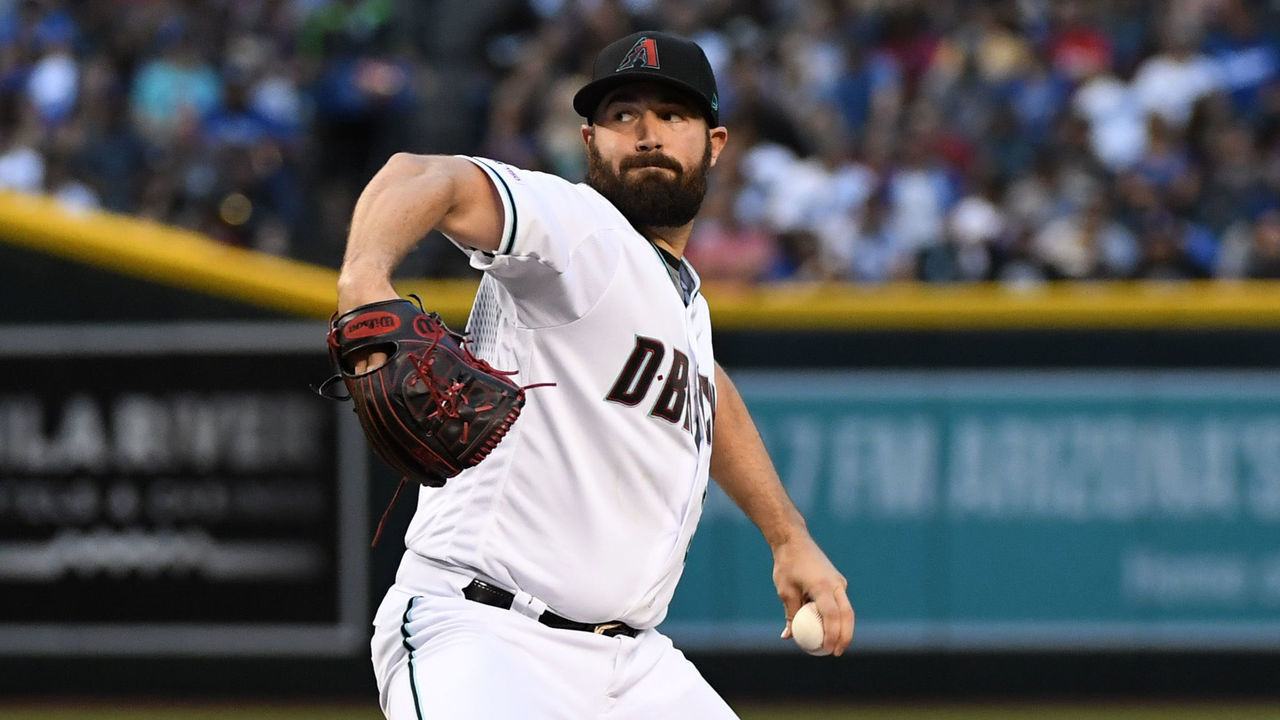 PHOENIX, ARIZONA - JUNE 25: Robbie Ray #38 of the Arizona Diamondbacks delivers a first inning pitch against the Los Angeles Dodgers at Chase Field on June 25, 2019 in Phoenix, Arizona.