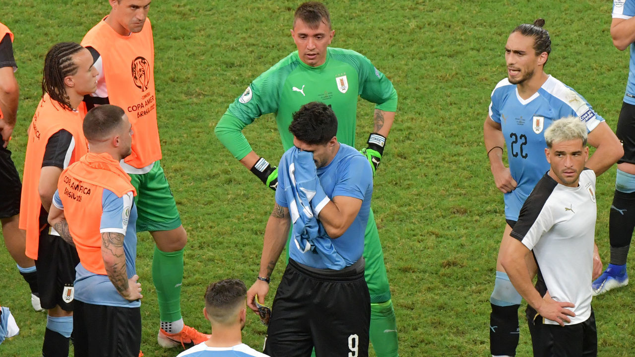 Uruguay's Luis Suarez (C) -whose penalty was stopped by Peru's goalkeeper Pedro Gallese- reacts after losing in the penalty shoot-out after tying 0-0 during their Copa America football tournament quarter-final match at the Fonte Nova Arena in Salvador, Brazil, on June 29, 2019.