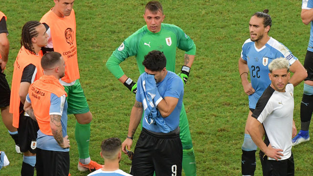 Uruguay's Luis Suarez (C) -whose penalty was stopped by Peru's goalkeeper Pedro Gallese- reacts after losing in the penalty shoot-out after tying 0-0 during their Copa America football tournament quarter-final match at the Fonte Nova Arena in Salvador, Brazil, on June 29, 2019.