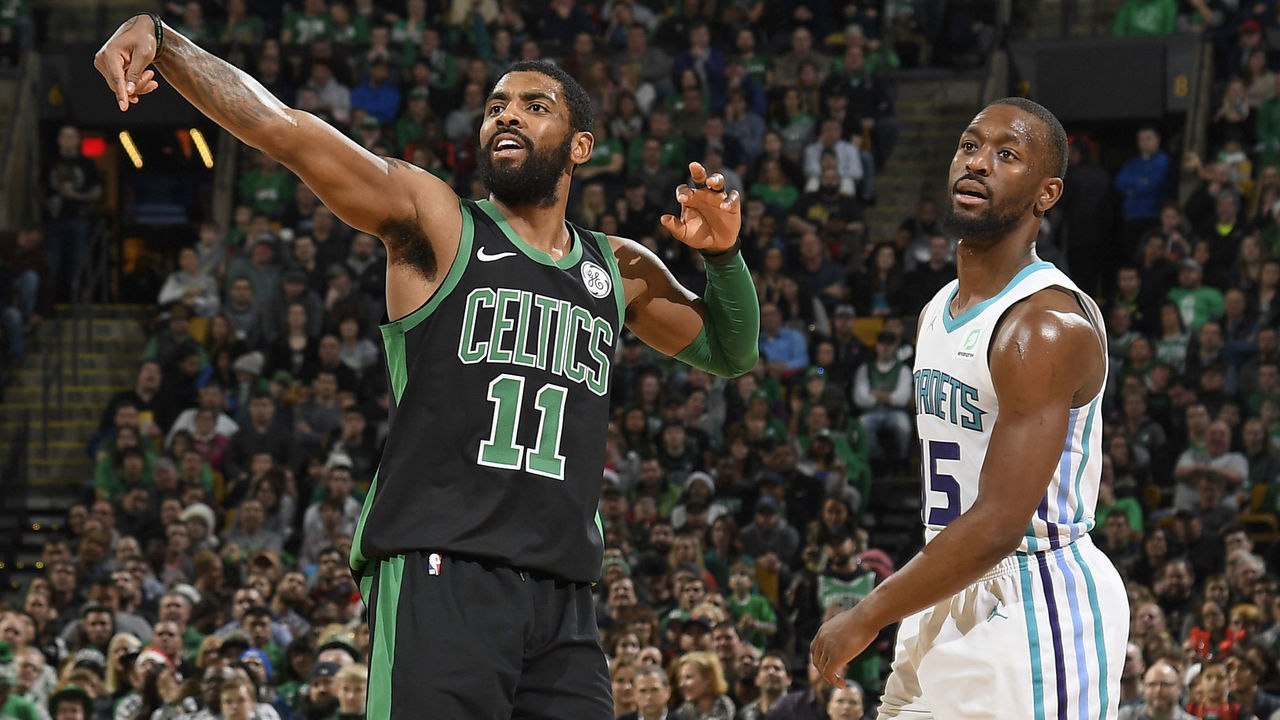 BOSTON, MA - DECEMBER 23: Kyrie Irving #11 of the Boston Celtics and Kemba Walker #15 of the Charlotte Hornets looks on during the game on December 23, 2018 at the TD Garden in Boston, Massachusetts. Mandatory Copyright Notice: Copyright 2018 NBAE