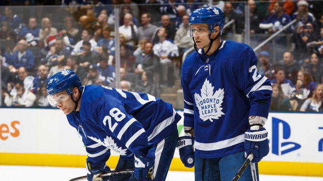 TORONTO, ON - DECEMBER 22: Connor Brown #28 and Nikita Zaitsev #22 of the Toronto Maple Leafs wait on a face off against the New York Rangers during the second period at the Scotiabank Arena on December 22, 2018 in Toronto, Ontario, Canada.