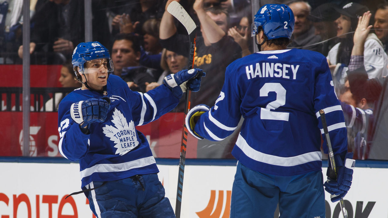 TORONTO, ON - NOVEMBER 19: Tyler Ennis #63 of the Toronto Maple Leafs celebrates his goal with teammate Ron Hainsey #2 during the second period against the Columbus Blue Jackets at the Scotiabank Arena on November 19, 2018 in Toronto, Ontario, Canada.
