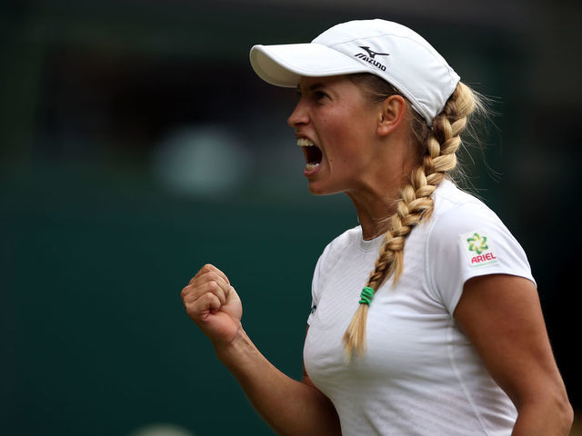 Yulia Putintseva celebrates winning the first set against Naomi Osaka on day one of the Wimbledon Championships at the All England Lawn Tennis and Croquet Club, Wimbledon.
