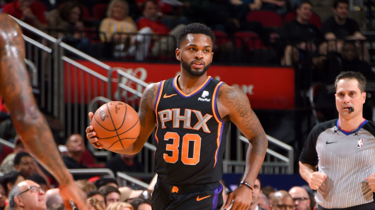 HOUSTON, TX - APRIL 7: Troy Daniels #30 of the Phoenix Suns handles the ball against the Houston Rockets on April 7, 2019 at the Toyota Center in Houston, Texas. NOTE TO USER: User expressly acknowledges and agrees that, by downloading and/or using this photograph, user is consenting to the terms and conditions of the Getty Images License Agreement. Mandatory Copyright Notice: Copyright 2019 NBAE