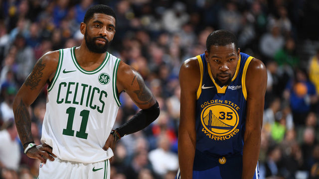 OAKLAND, CA - MARCH 5: Kyrie Irving #11 of the Boston Celtics and Kevin Durant #35 of the Golden State Warriors looks on during the game on March 5, 2019 at ORACLE Arena in Oakland, California. NOTE TO USER: User expressly acknowledges and agrees that, by downloading and or using this photograph, user is consenting to the terms and conditions of Getty Images License Agreement. Mandatory Copyright Notice: Copyright 2019 NBAE