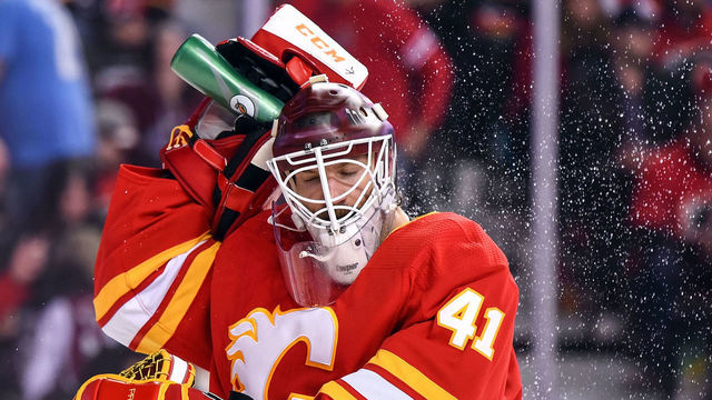 CALGARY, AB - APRIL 19: Calgary Flames Goalie Mike Smith (41) sprays himself with water after giving up a goal during the third period of Game Five of the Western Conference First Round during the 2019 Stanley Cup Playoffs where the Calgary Flames hosted the Colorado Avalanche on April 19, 2019, at the Scotiabank Saddledome in Calgary, AB.