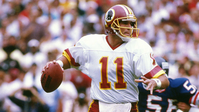 WASHINGTON, D.C. - OCTOBER 2: Mark Rypien #11 of the Washington Redskins drops back to pass against the New York Giants during an NFL football game October 2, 1988 at RFK Stadium in Washington, D.C.. Rypien played for the Redskins from 1986-93.