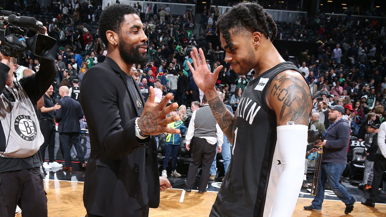 BROOKLYN, NY - MARCH 30: D'Angelo Russell #1 of the Brooklyn Nets and Kyrie Irving #11 of the Boston Celtics hug after the game on March 30, 2019 at Barclays Center in Brooklyn, New York. Mandatory Copyright Notice: Copyright 2019 NBAE
