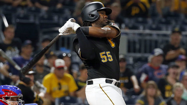 PITTSBURGH, PA - JULY 01: Josh Bell #55 of the Pittsburgh Pirates hits a two run home run in the eighth inning against the Chicago Cubs at PNC Park on July 1, 2019 in Pittsburgh, Pennsylvania.