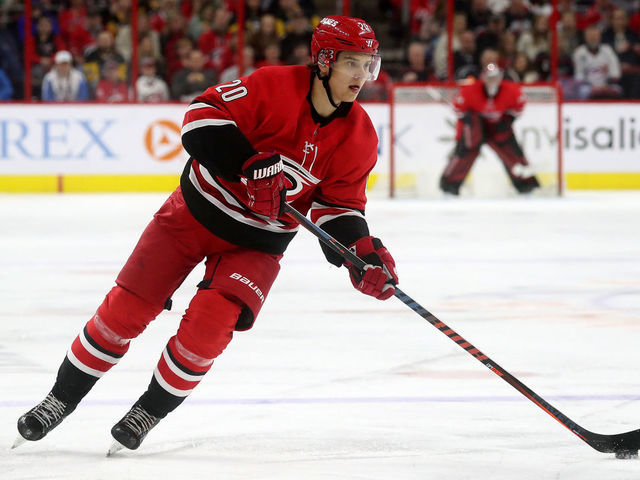 RALEIGH, NC - MARCH 19: Sebastian Aho #20 of the Carolina Hurricanes controls the puck on the ice during an NHL game against the Pittsburgh Penguins on March 19, 2019 at PNC Arena in Raleigh, North Carolina.