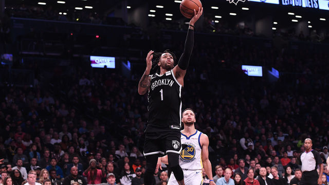 NEW YORK, NY - OCTOBER 28: D'Angelo Russell #1 of the Brooklyn Nets lays up a shot against Stephen Curry #30 of the Golden State Warriors during the game at Barclays Center on October 28, 2018 in the Brooklyn borough of New York City.