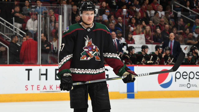 GLENDALE, AZ - MARCH 16: Lawson Crouse #67 of the Arizona Coyotes gets ready prior to a faceoff against the Edmonton Oilers at Gila River Arena on March 16, 2019 in Glendale, Arizona.