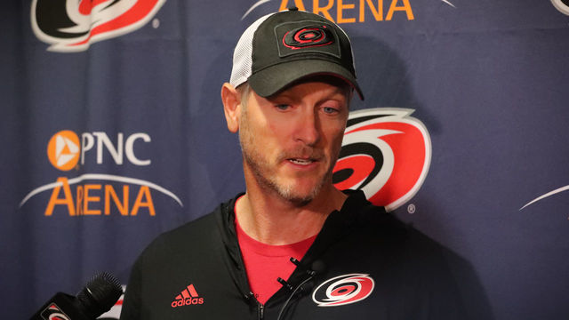 RALEIGH, NC - FEBRUARY 19: Carolina Hurricanes owner Tom Dundon gets interviewed before the warmups of the Carolina Hurricanes game versus the New York Rangers on February 19th, 2019 at PNC Arena in Raleigh, NC.