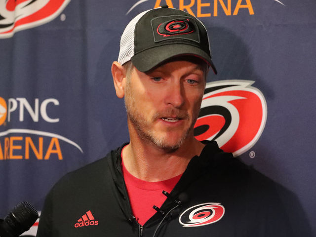 RALEIGH, NC - FEBRUARY 19: Carolina Hurricanes owner Tom Dundon gets interviewed before the warmups of the Carolina Hurricanes game versus the New York Rangers on February 19th, 2019 at PNC Arena in Raleigh, NC.