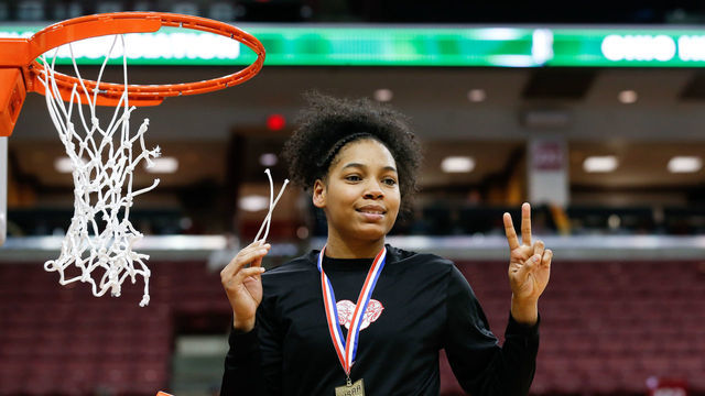 COLUMBUS, OH - MARCH 16: Toledo Rogers guard Zia Cooke cuts down the net during the awards ceremony following the Ohio High School Athletic Association (OHSAA) girls Division II state championship game between Toledo Rogers and Dayton Carroll on March 16, 2019 at Value City Arena in Columbus, Ohio.