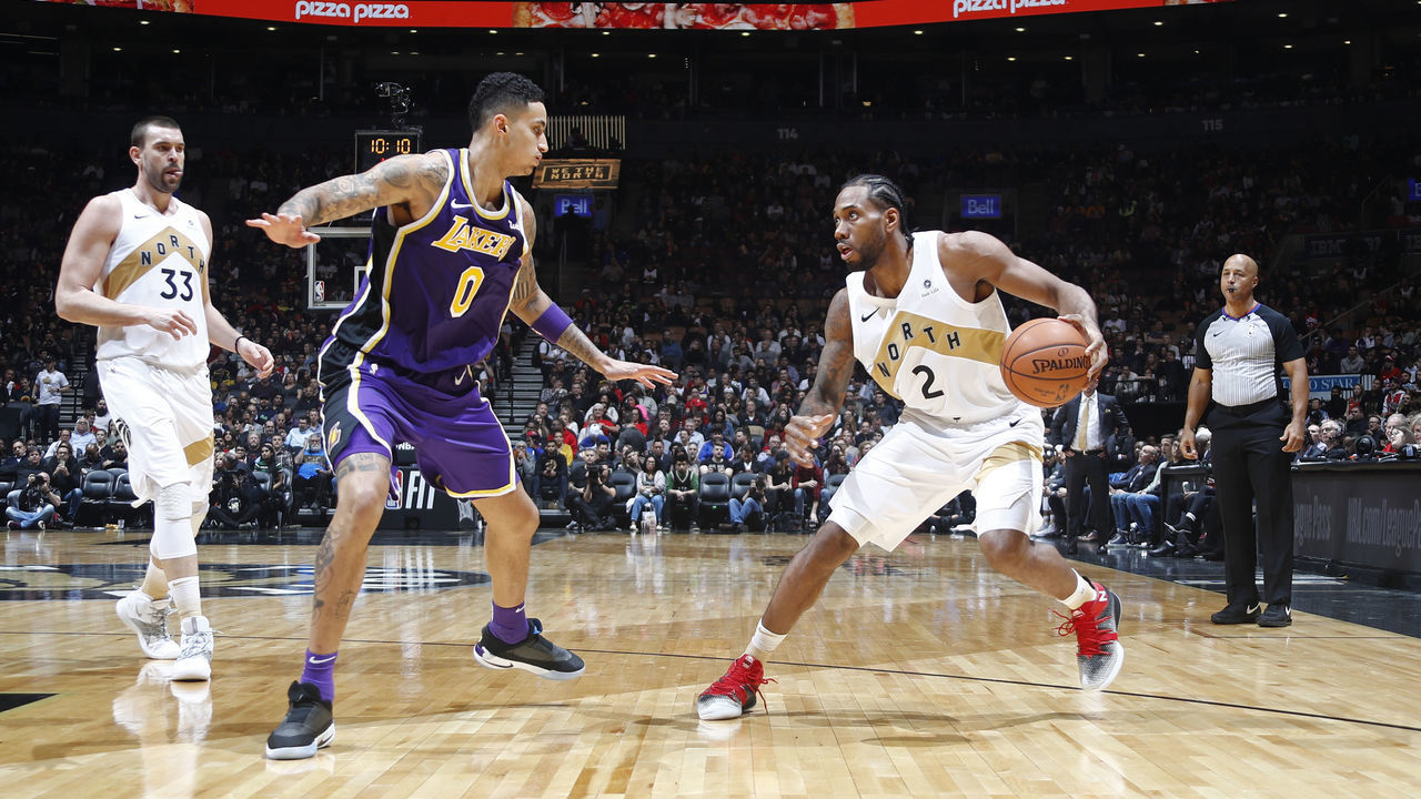 TORONTO, CANADA - MARCH 14: Kawhi Leonard #2 of the Toronto Raptors handles the ball against Kyle Kuzma #0 of the Los Angeles Lakers on March 14, 2019 at the Scotiabank Arena in Toronto, Ontario, Canada. Mandatory Copyright Notice: Copyright 2019 NBAE