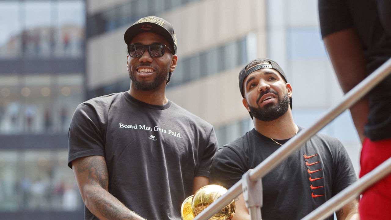 TORONTO, ON - JUNE 17: Kawhi Leonard #2 of the Toronto Raptors and Rapper Drake are seen on the team bus during the Toronto Raptors Championship Victory Parade on June 17, 2019 in Toronto, Ontario. NOTE TO USER: User expressly acknowledges and agrees that, by downloading and/or using this photograph, user is consenting to the terms and conditions of Getty Images License Agreement. Mandatory Copyright Notice: Copyright 2019 NBAE