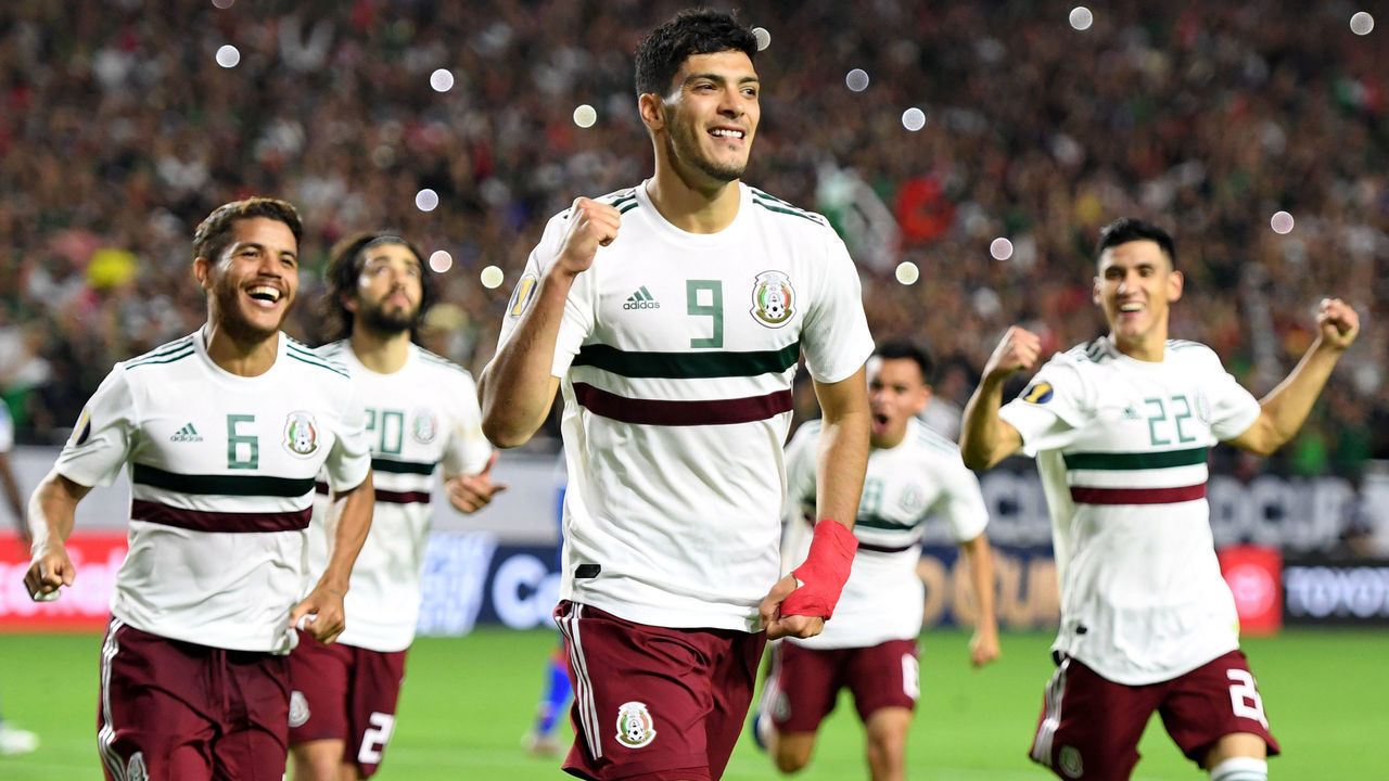Mexico's forward Raul Jimenez (C) celebrates with teammates after scoring a goal in overtime during the 2019 Concacaf Gold Cup semifinal football match between Mexico and Haiti on July 2, 2019 in Glendale, Arizona.