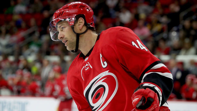 RALEIGH, NC - FEBRUARY 16: Justin Williams #14 of the Carolina Hurricanes skates for position on the ice during an NHL game against the Dallas Stars on February 16, 2019 at PNC Arena in Raleigh, North Carolina.