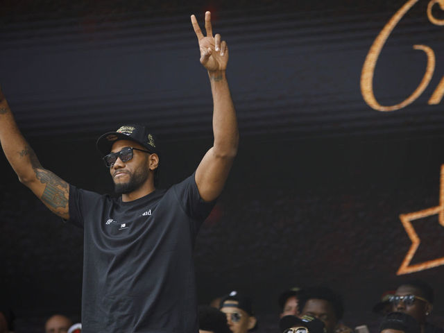 TORONTO, ON - JUNE 17: Kawhi Leonard #2 of the Toronto Raptors waves to the crowd during the Toronto Raptors Championship Victory Parade on June 17, 2019 in Toronto, Ontario. NOTE TO USER: User expressly acknowledges and agrees that, by downloading and/or using this photograph, user is consenting to the terms and conditions of Getty Images License Agreement. Mandatory Copyright Notice: Copyright 2019 NBAE