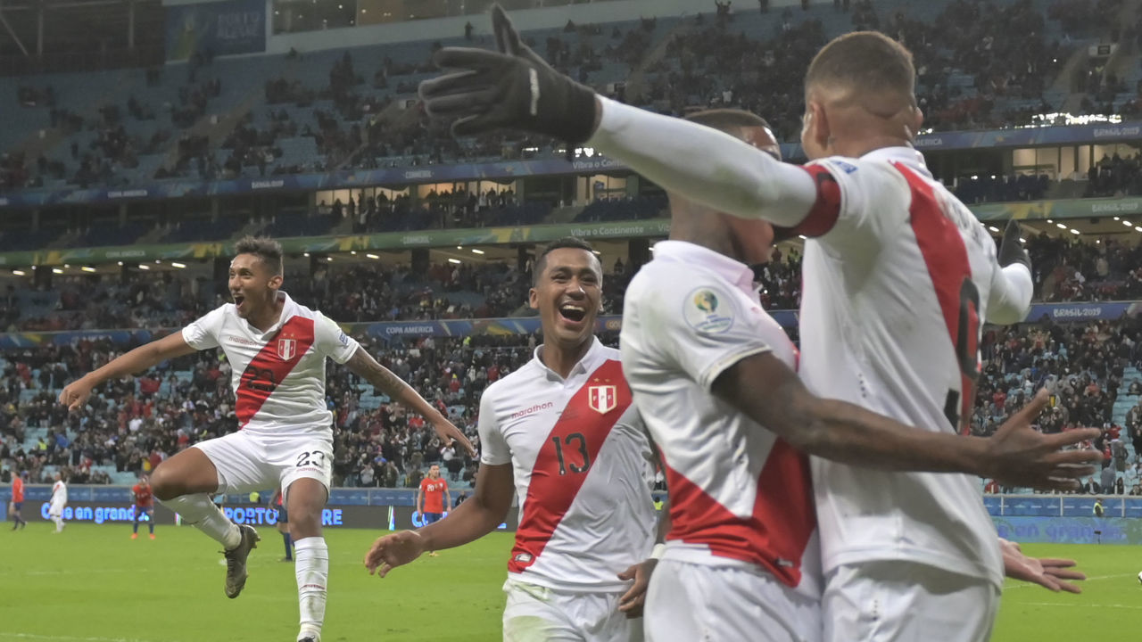 Peru's Paolo Guerrero (R) celebrates with teammates after scoring against Chile during their Copa America football tournament semi-final match at the Gremio Arena in Porto Alegre, Brazil, on July 3, 2019.