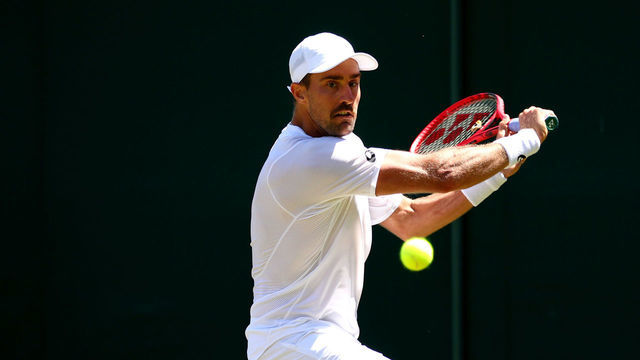LONDON, ENGLAND - JULY 04: Steve Johnson of The United States plays a backhand in his Men's Singles second round match against Alex de Minaur of Australia during Day four of The Championships - Wimbledon 2019 at All England Lawn Tennis and Croquet Club on July 04, 2019 in London, England.