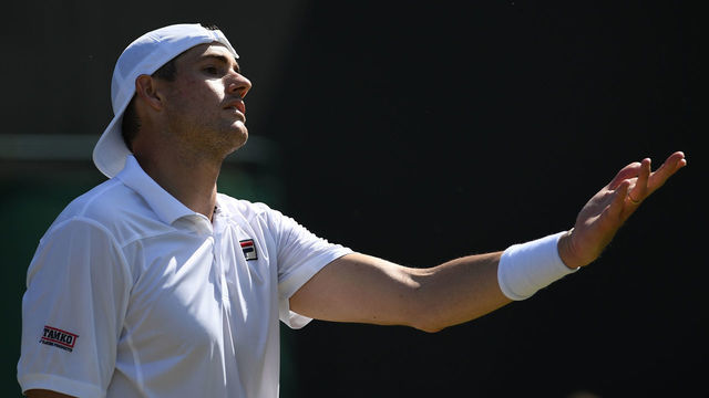 US player John Isner reacts after a point against Kazakhstan's Mikhail Kukushkin during their men's singles second round match on the fourth day of the 2019 Wimbledon Championships at The All England Lawn Tennis Club in Wimbledon, southwest London, on July 4, 2019.