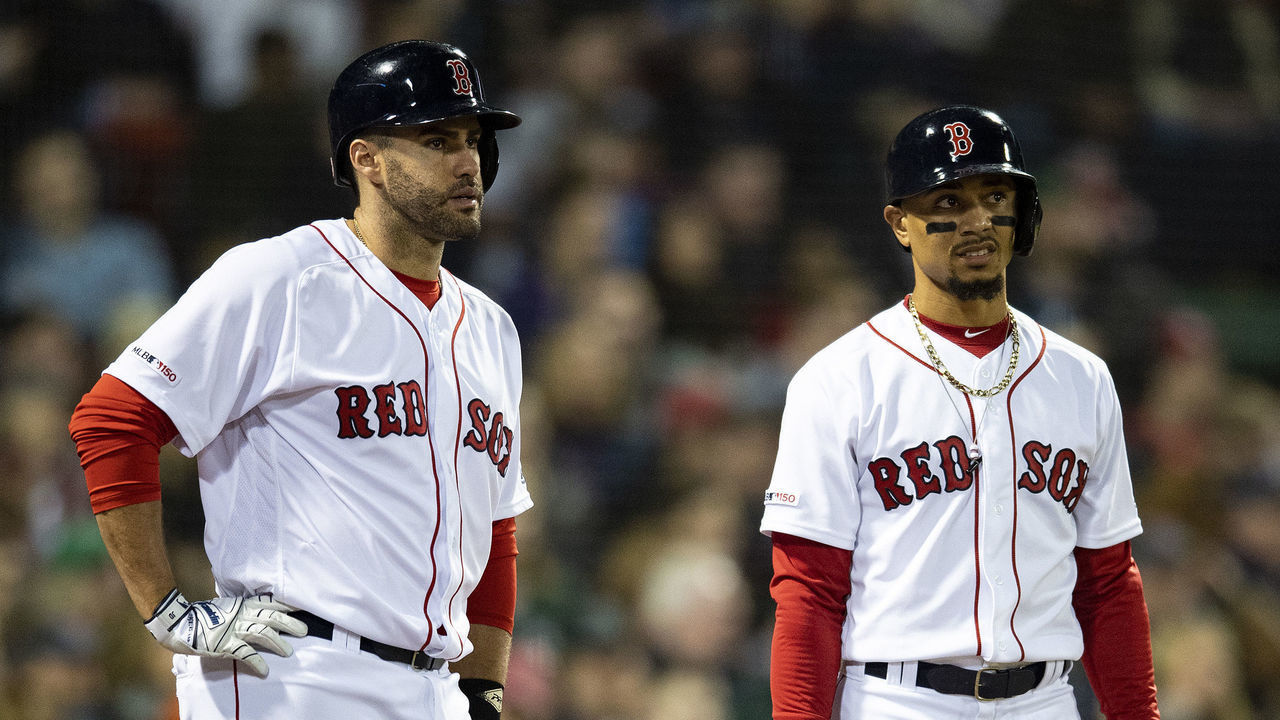 BOSTON, MA - APRIL 29: J.D. Martinez #28 and Mookie Betts #50 of the Boston Red Sox look on during the third inning of a game against the Oakland Athletics on April 29, 2019 at Fenway Park in Boston, Massachusetts.