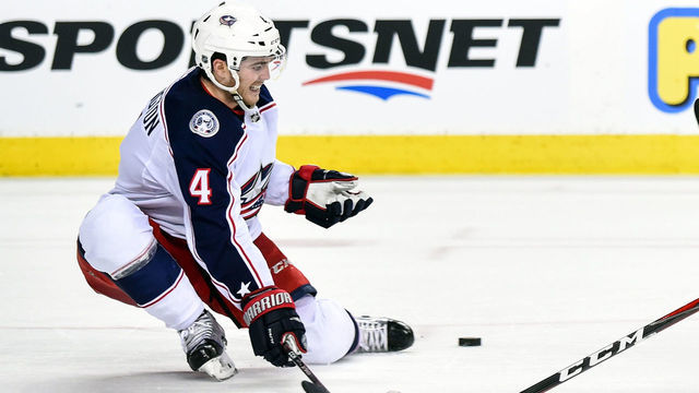 CALGARY, AB - MARCH 19: Columbus Blue Jackets Defenceman Scott Harrington (4) blocks a shot during the second period of an NHL game where the Calgary Flames hosted the Columbus Blue Jackets on March 19, 2019, at the Scotiabank Saddledome in Calgary, AB.